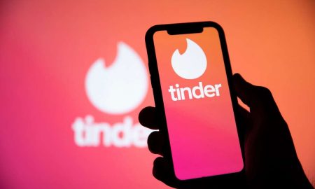 LONDON, UK April 29 2020: Tinder online dating app logo on a smartphone