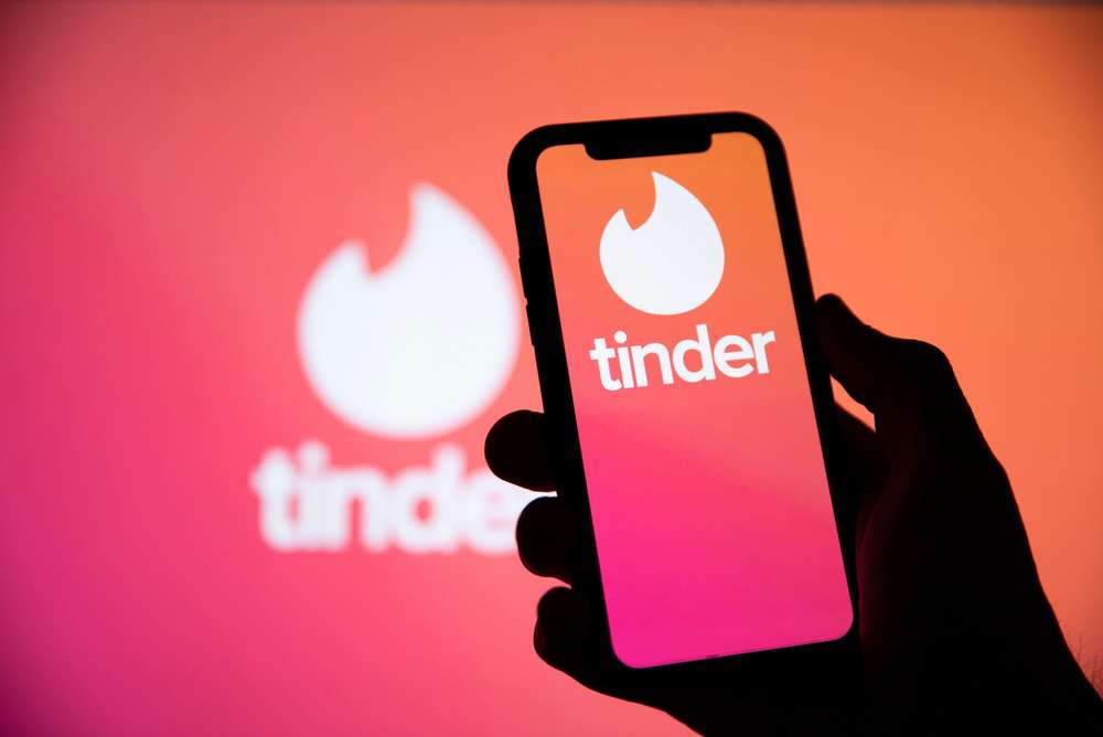 LONDON, UK April 29 2020: Tinder online dating app logo on a smartphone